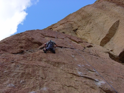 Dane Peterson ascending the crack traverse next to Ring of Fire - Smith Rock - Climbing Oregon
