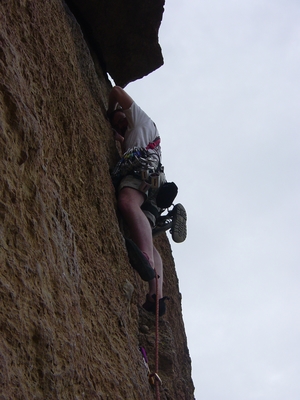 Joel Hass coming out from under the roof on Spiderman - Smith Rock - Climbing Oregon